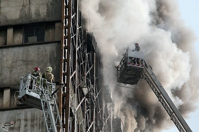 Firefighters try to put out a fire in a blazing high-rise building in Tehran, Iran January 19, 2017. Tasnim News Agency/Handout via REUTERS ATTENTION EDITORS - THIS PICTURE WAS PROVIDED BY A THIRD PARTY. FOR EDITORIAL USE ONLY. NO RESALES. NO ARCHIVE.