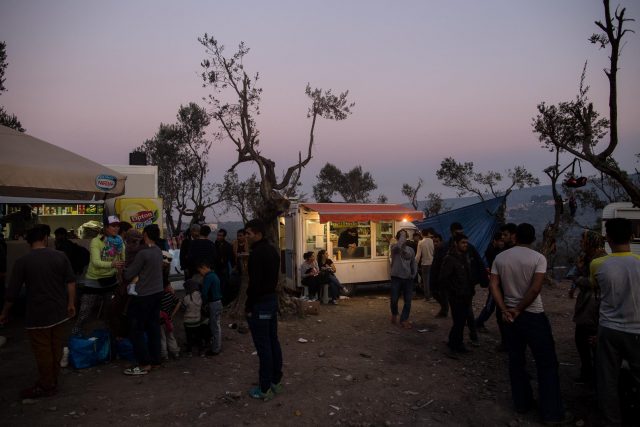 Migrants from Pakistan and Afghanistan waiting outside of the registration camp in Moria, Lesbos on October 14, 2015.