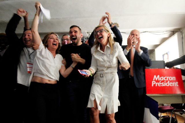 Supporters of French President-elect Emmanuel Macron, head of the political movement En Marche !, or Onwards !, react after announcement in the second round of 2017 French presidential election at  En Marche local headquarters in Marseille, France, May 7, 2017. REUTERS/Philippe Laurenson