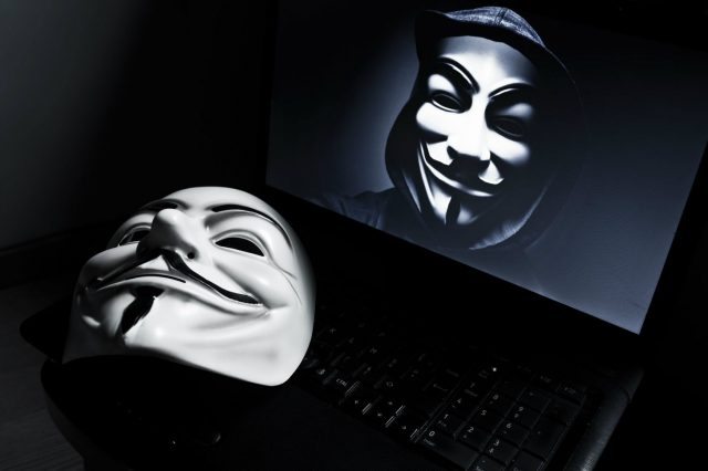 Anonymous-mask-and-laptop