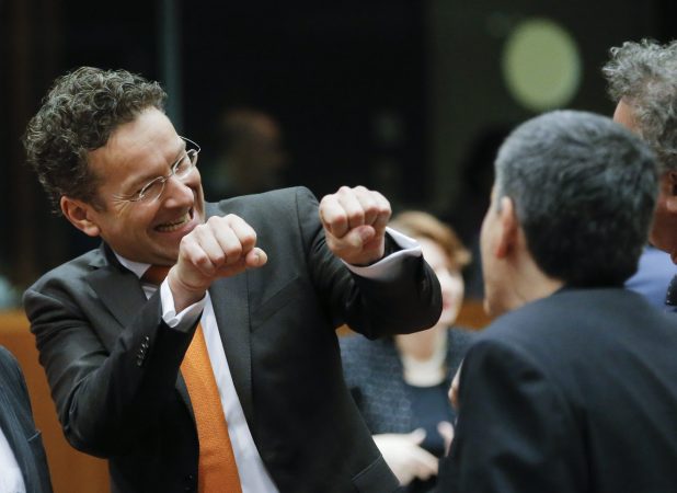epa05200343 President of Eurogroup, Dutch Finance Minister Jeroen Dijsselbloem (C) gestures with his hands in the direction of Greek Finance Minister Euclid Tsakalotos during an Ecofin Finance ministers meeting in Brussels, Belgium,  08 March 2016. The Council will aim to reach a political agreement on the proposed amendment to the directive on mandatory exchange of information in the field of taxation.  EPA/OLIVIER HOSLET
