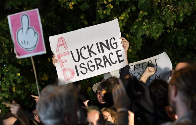 epa06225091 People protest against the Alternative for Germany (AfD) party near to a night club where right-wing populist party AfD holds their election event in Berlin, Germany, 24 September 2017. According to federal election commissioner more than 61 million people were eligible to vote in the elections for a new federal parliament, the Bundestag, in Germany. EPA/THORSTEN WAGNER