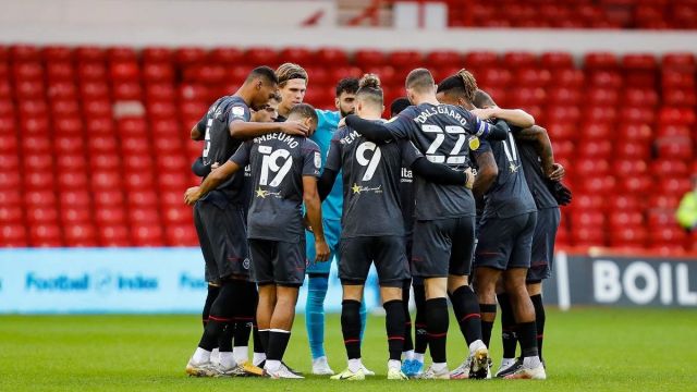 Brentford players speaking each other