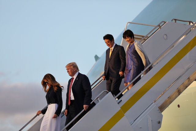 U.S. President Donald Trump his wife Melania (L), Japanese Prime Minister Shinzo Abe (2nd R) and his wife Akie Abe arrive at the International Airport in West Palm Beach, Florida U.S., February 10, 2017. REUTERS/Carlos Barria