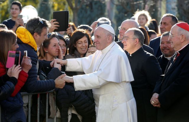 Pope Francis greets faithful during a visit to the parish of St. Mary Josefa of the Heart of Jesus in Rome, Italy, February 19, 2017. REUTERS/Remo Casilli