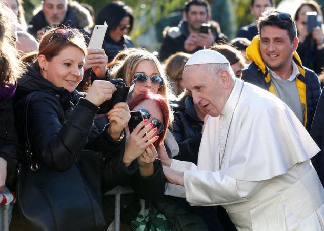 Faithful take selfies with Pope Francis during a visit to the parish of St. Mary Josefa of the Heart of Jesus in Rome, Italy February 19, 2017. REUTERS/Remo Casilli