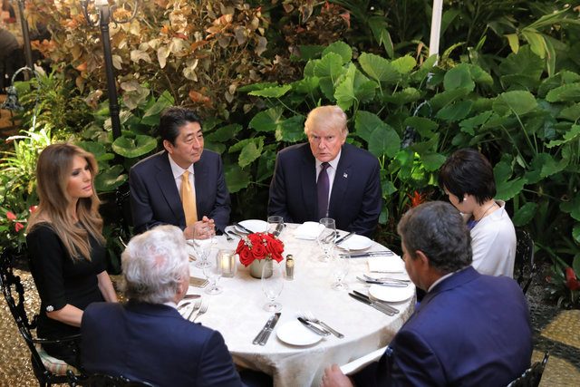 Japanese Prime Minister Shinzo Abe and Akie Abe (R) attend dinner with U.S. President Donald Trump his wife Melania, and Robert Kraft (2nd-L), owner of the New England Patriots at Mar-a-Lago Club in Palm Beach, Florida U.S., February 10, 2017. REUTERS/Carlos Barria