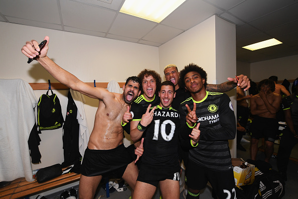 WEST BROMWICH, ENGLAND - MAY 12: Diego Costa of Chelsea (L), David Luiz of Chelsea (CL), Eden Hazard of Chelsea (CR) and Willian of Chelsea (R) celebrate winning the league in the changing room after the Premier League match between West Bromwich Albion and Chelsea at The Hawthorns on May 12, 2017 in West Bromwich, England. (Photo by Darren Walsh/Chelsea FC via Getty Images)