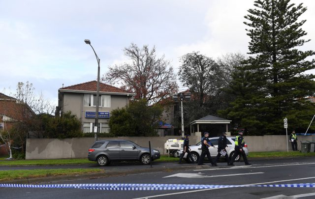 Police are pictured outside the Buckingham Serviced Apartments in Brighton in Melbourne, Australia, June 6, 2017 after police on Monday shot dead Yacqub Khayre after he held a woman hostage.   AAP/Julian Smith/via REUTERS  ATTENTION EDITORS - THIS PICTURE WAS PROVIDED BY A THIRD PARTY. EDITORIAL USE ONLY. NO RESALES. NO ARCHIVE. AUSTRALIA OUT. NEW ZEALAND OUT.