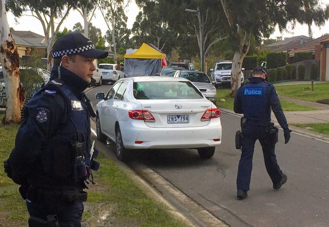 Australian police search what is believed to be the home of gunman Yacqub Khayre, who was shot dead by police on Monday after he shot a man dead and held a woman hostage, in the Melbourne suburb of Roxburgh Park in Australia, June 6, 2017. REUTERS/Sonali Paul