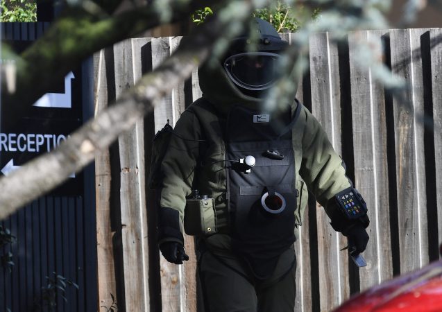 A bomb squad member walks outside the site of a shooting at Buckingham Serviced Apartments in Brighton, Melbourne, Australia, June 6, 2017.      AAP/Julian Smith/via REUTERS  ATTENTION EDITORS - THIS PICTURE WAS PROVIDED BY A THIRD PARTY. EDITORIAL USE ONLY. NO RESALES. NO ARCHIVE. AUSTRALIA OUT. NEW ZEALAND OUT.      TPX IMAGES OF THE DAY