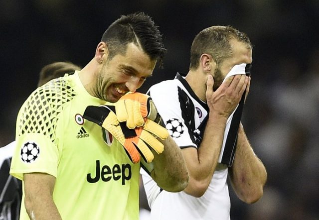epa06008865 Juventus goalkeeper Gianluigi Buffon and defender Giorgio Chiellini (R) react after the end of the UEFA Champions League final between Juventus FC and Real Madrid at the National Stadium of Wales in Cardiff, Britain, 03 June 2017. EPA/GERRY PENNY