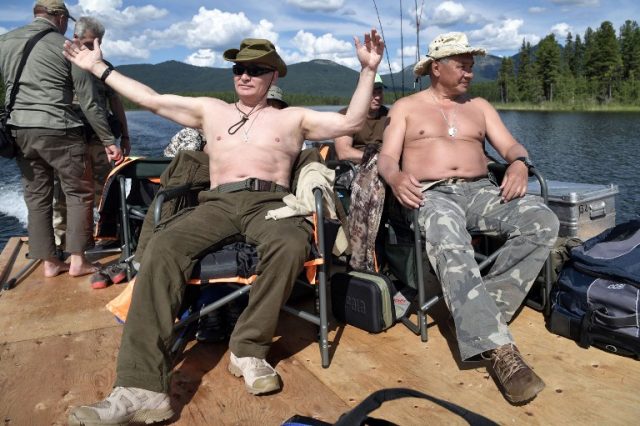 3166075 08/05/2017 Russian President Vladimir Putin and Russian Defense Minister Sergei Shoigu, right, during a fishing trip at the cascade of mountain lakes in the Republic of Tyva, during the President's vacation on August 1-3. Aleksey Nikolskyi/Sputnik