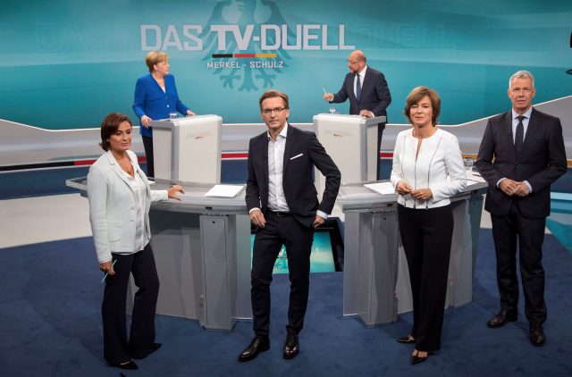 TV hosts Sandra Maischberger (ARD), Claus Strunz (ProSieben/SAT.1), Maybrit Illner (ZDF) and Peter Kloeppel (RTL) pose as German Chancellor Angela Merkel of the Christian Democratic Union (CDU) and her challenger, Germany's Social Democratic Party SPD candidate for chancellor Martin Schulz, take part in a TV debate in Berlin, Germany, September 3, 2017. German voters will take to the polls in a general election on September 24. Herby Sachs/WDR/Handout via REUTERS ATTENTION EDITORS - THIS IMAGE WAS PROVIDED BY A THIRD PARTY. NO RESALES. NO ARCHIVE.