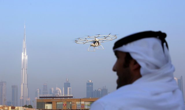 A man looks on as the flying taxi is seen in Dubai, United Arab Emirates September 25, 2017. REUTERS/Satish Kumar
