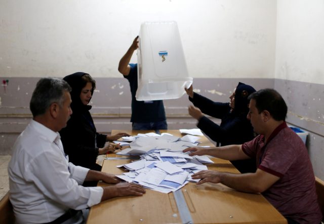 Officials empty a ballot box after the close of the polling station during Kurds independence referendum in Erbil, Iraq September 25, 2017. REUTERS/Ahmed Jadallah