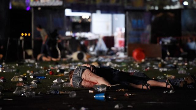 LAS VEGAS NV - OCTOBER 01 EDITORS NOTE Image contains graphic content A person lies on the ground covered with blood at the Route 91 Harvest country music festival after apparent gun fire was heard on October 1 2017 in Las Vegas Nevada There are reports of an active shooter around the Mandalay Bay Resort and Casino David Becker Getty Images AFP FOR NEWSPAPERS INTERNET TELCOS TELEVISION USE ONLY